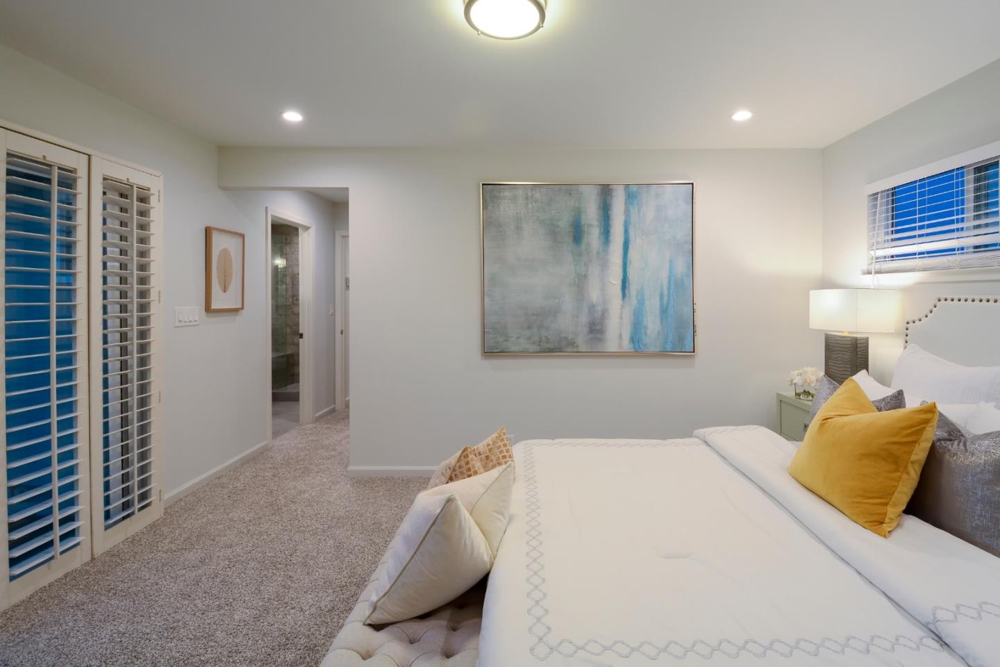 10166 Bonny Drive Cupertino, CA 95014 - Photo 20 of 46 a bedroom with a bed and a night stand