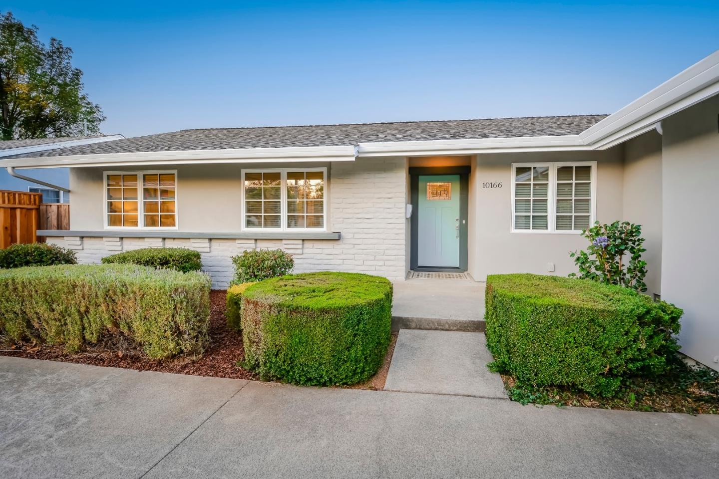 10166 Bonny Drive Cupertino, CA 95014 - Photo 2 of 46 front view of a house with a garden