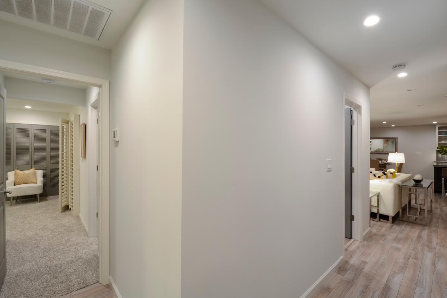 10166 Bonny Drive Cupertino, CA 95014 - Photo 33 of 46 a view of a hallway with toilet and a living room