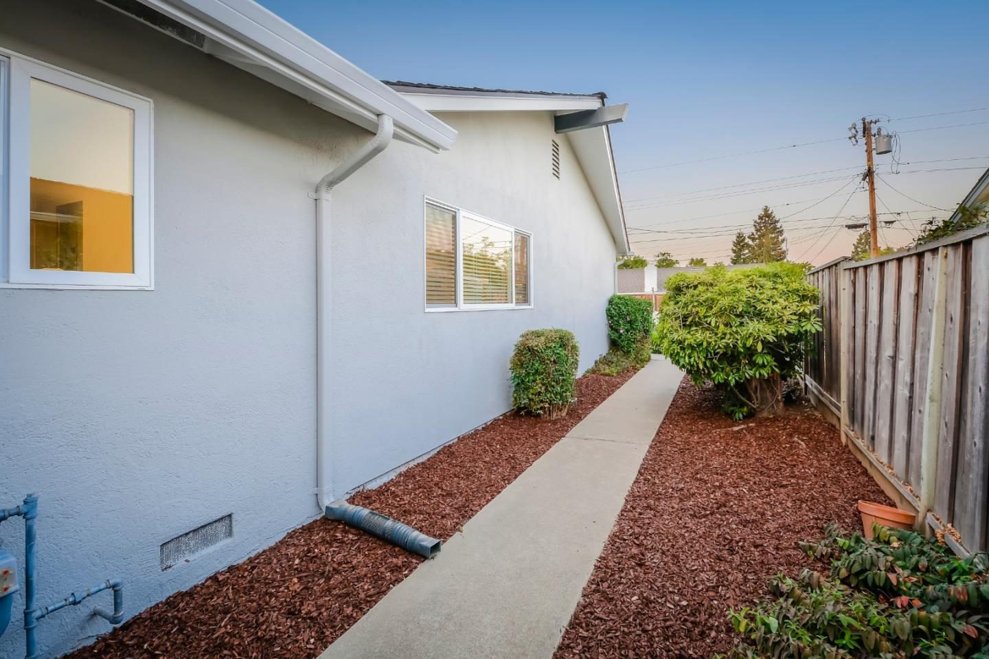 10166 Bonny Drive Cupertino, CA 95014 - Photo 40 of 46 a view of a backyard with potted plants