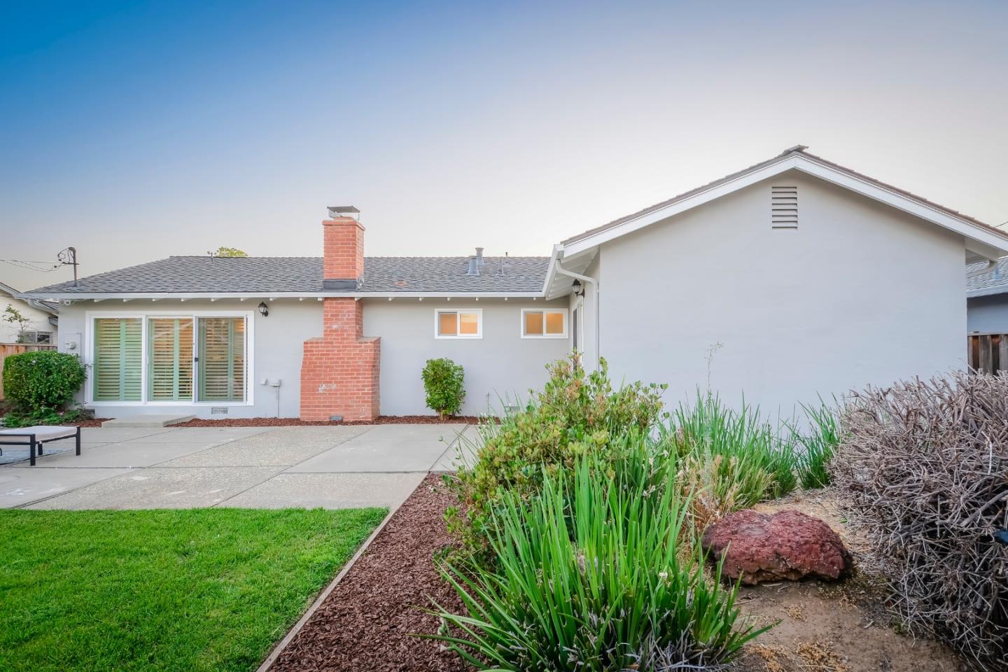 10166 Bonny Drive Cupertino, CA 95014 - Photo 41 of 46 a front view of a house with garden