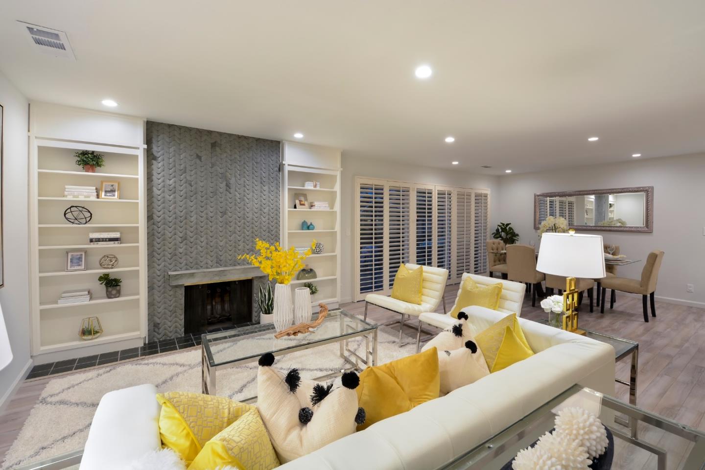 10166 Bonny Drive Cupertino, CA 95014 - Photo 7 of 46 a living room with furniture fireplace and a flat screen tv