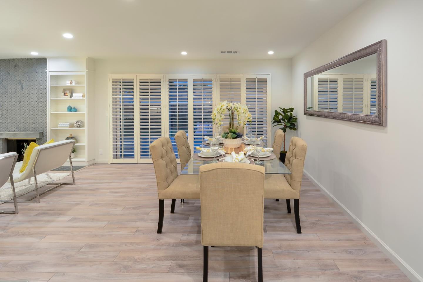 10166 Bonny Drive Cupertino, CA 95014 - Photo 8 of 46 a view of a livingroom with furniture and a window