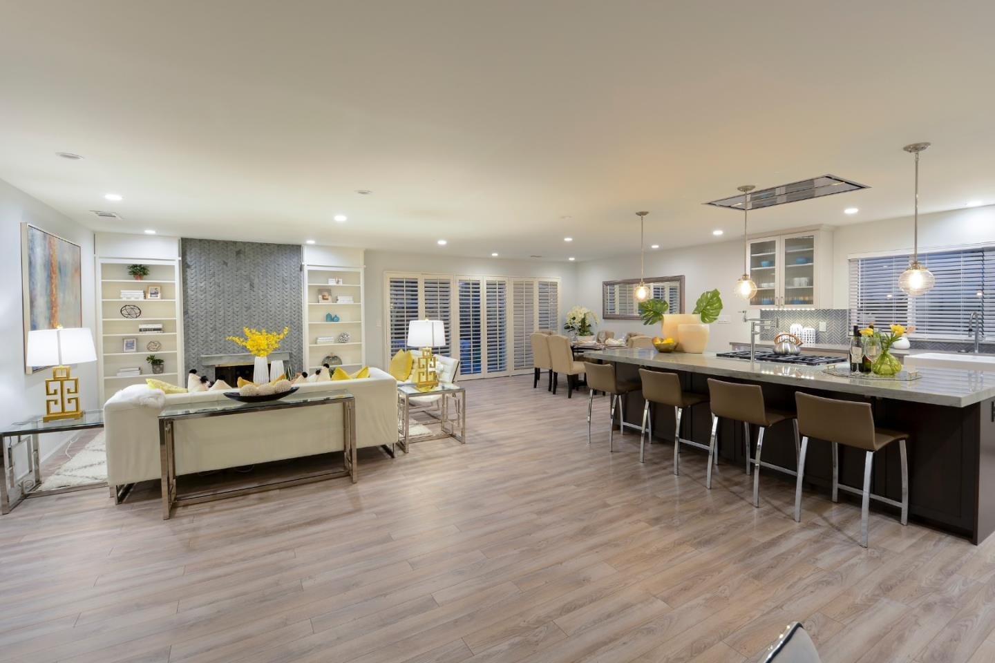 10166 Bonny Drive Cupertino, CA 95014 - Photo 9 of 46 a living room with furniture kitchen view and a wooden floor