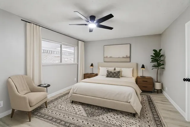 a bedroom with a bed couch and window