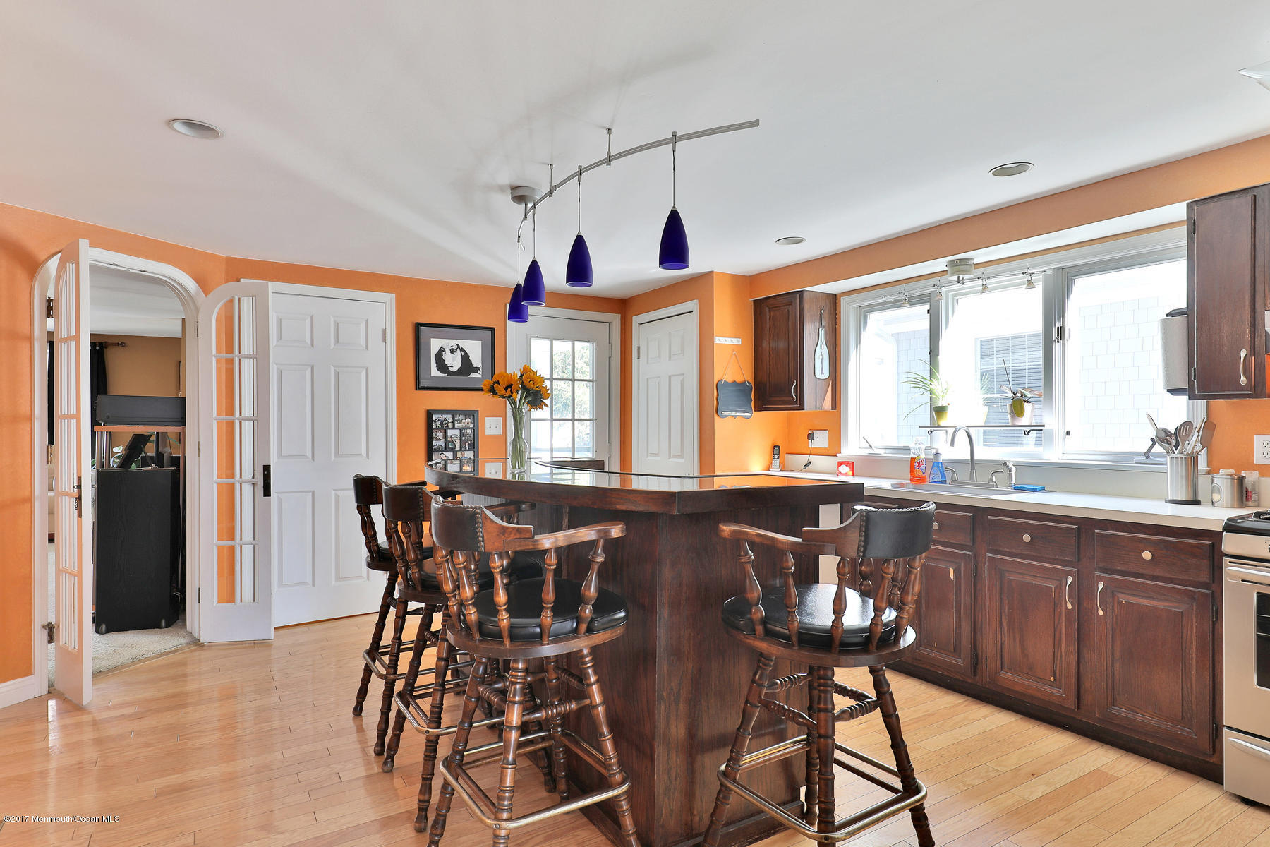 290 Spring Street Red Bank, NJ 07701 - Photo 7 of 26 a view of a dining room and livingroom with furniture window and wooden floor