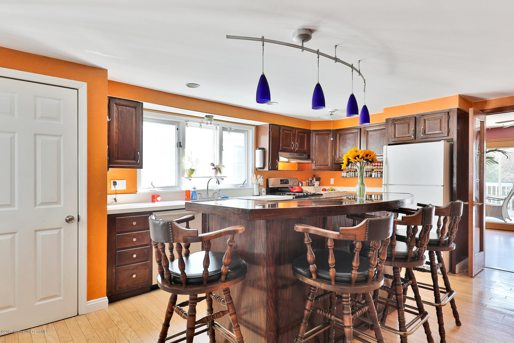 290 Spring Street Red Bank, NJ 07701 - Photo 8 of 26 a kitchen with stainless steel appliances granite countertop a dining table and chairs