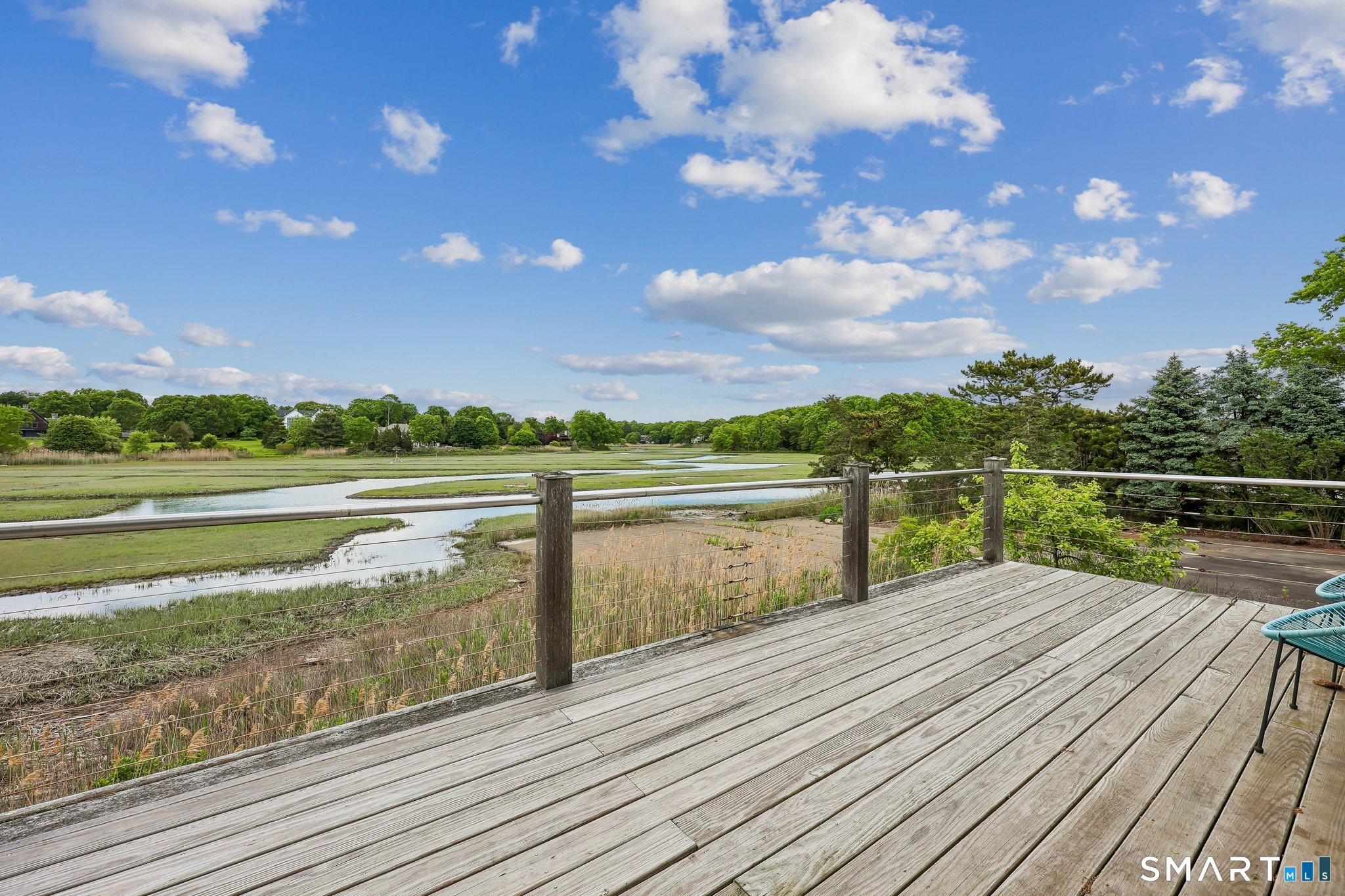 153 Middle Beach Road Madison, CT 06443 - Photo 30 of 40 The deck is great for entertaining and dining among nature. The views outside overlook the serpentine river