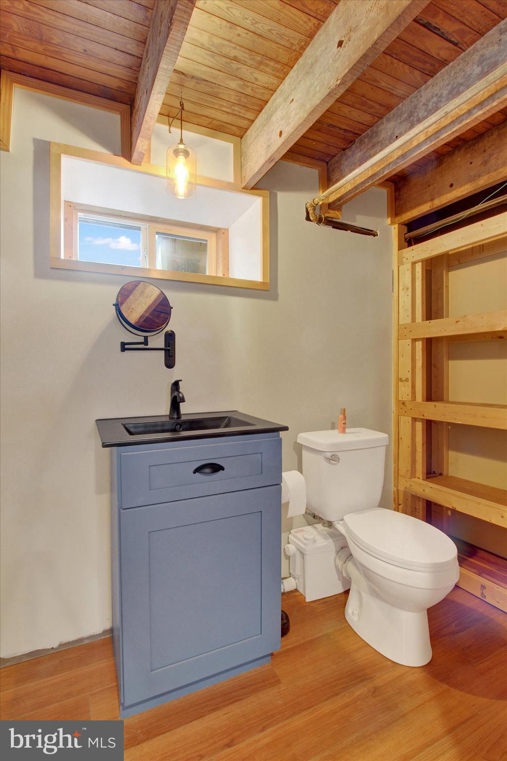 516 North Scott Street York, PA 17404 - Photo 14 of 22 a bathroom with a toilet sink and mirror