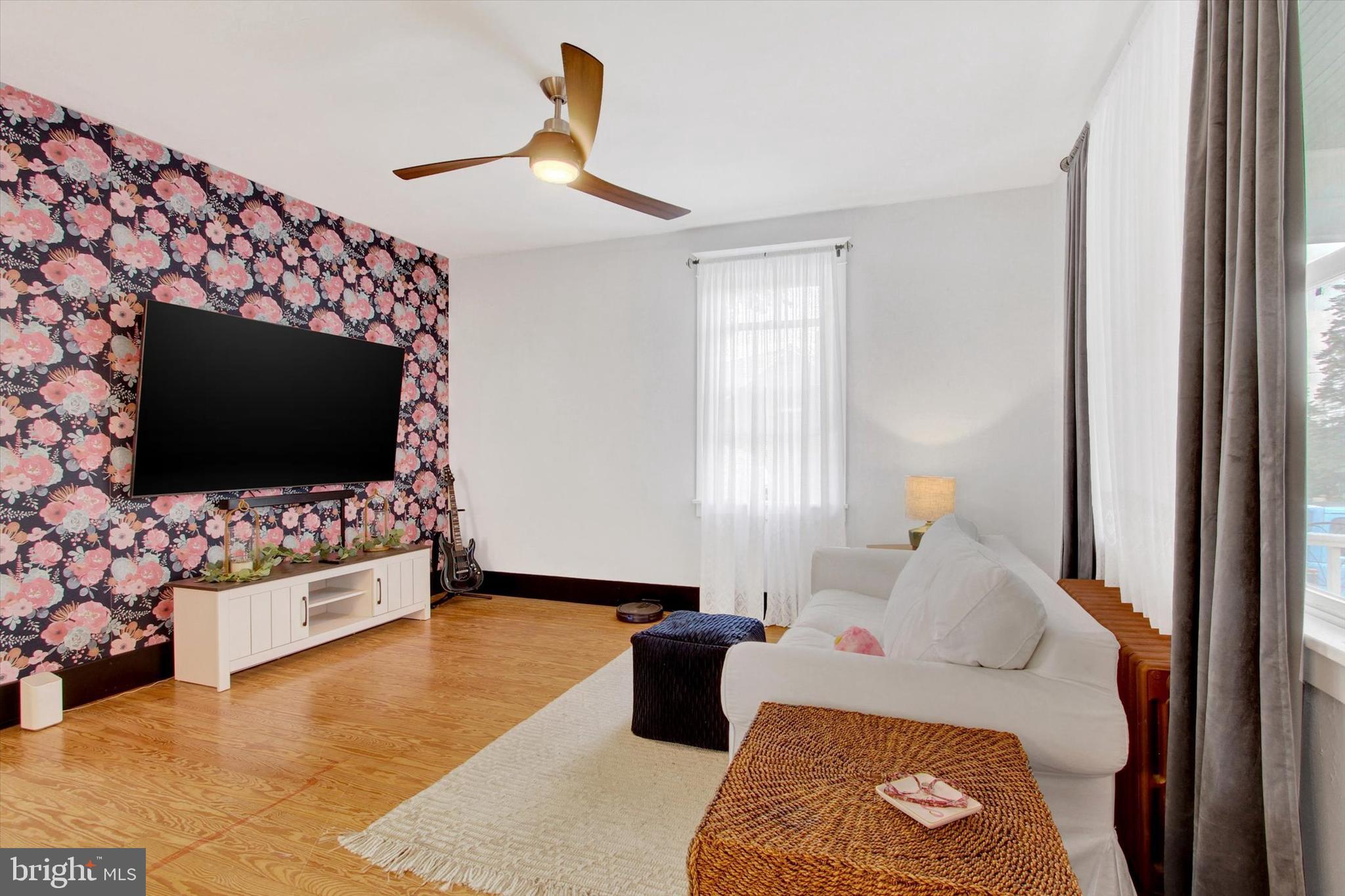 516 North Scott Street York, PA 17404 - Photo 2 of 22 a bedroom with furniture and a flat screen tv