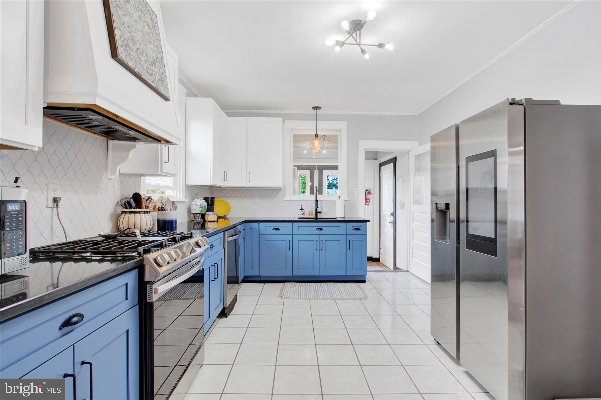 516 North Scott Street York, PA 17404 - Photo 5 of 22 a kitchen with stainless steel appliances granite countertop a stove a refrigerator and a sink