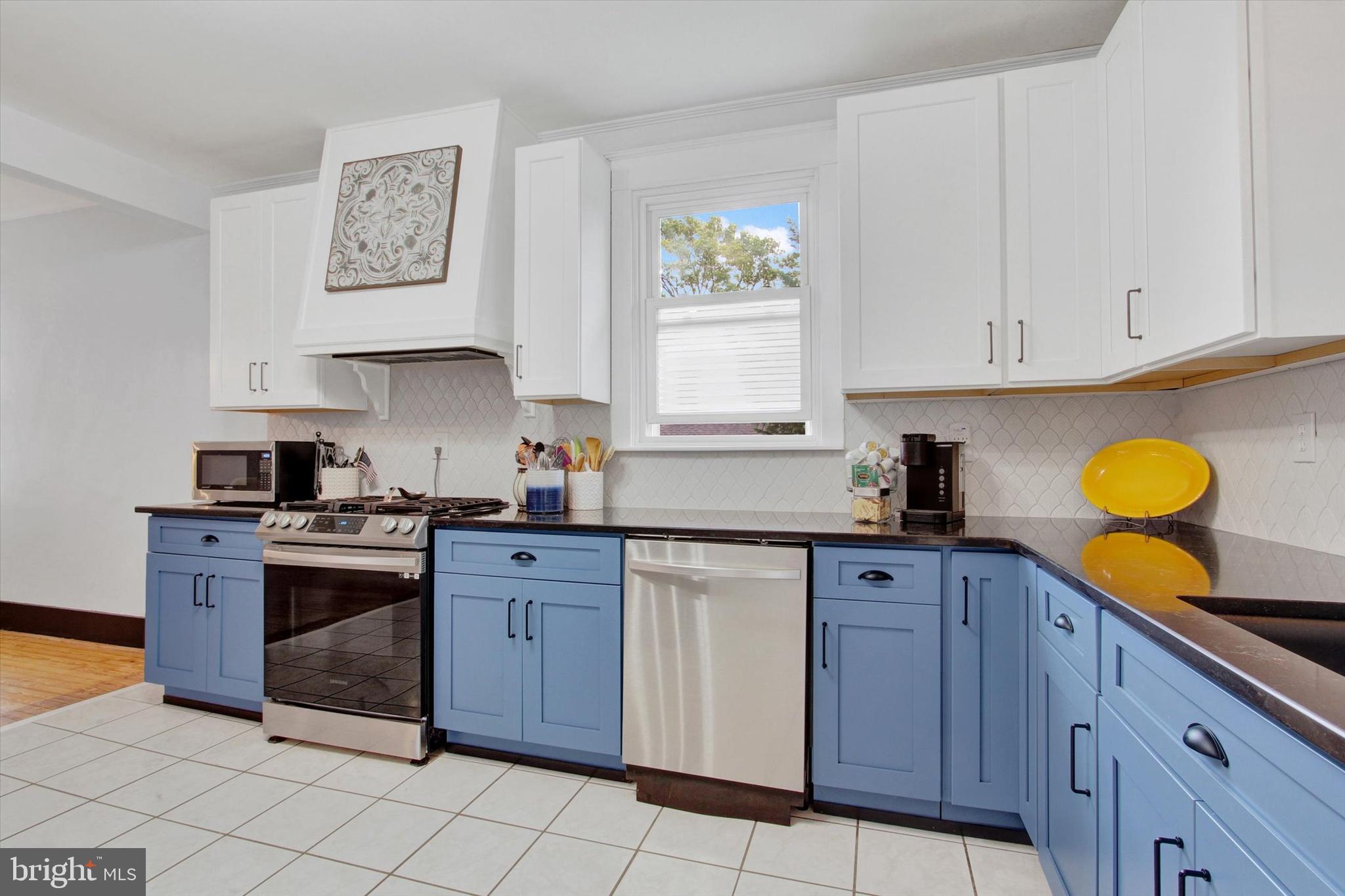 516 North Scott Street York, PA 17404 - Photo 6 of 22 a kitchen with cabinets appliances and a window
