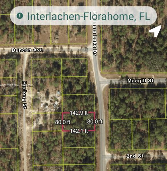 128 North Francis Interlachen, FL 32148 - Photo 4 of 7 a picture of a glass door with an outdoor space