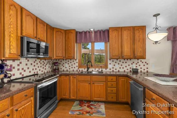 $615,000 | 2264 Grand Valley Drive Northeast, Ada, MI 49301