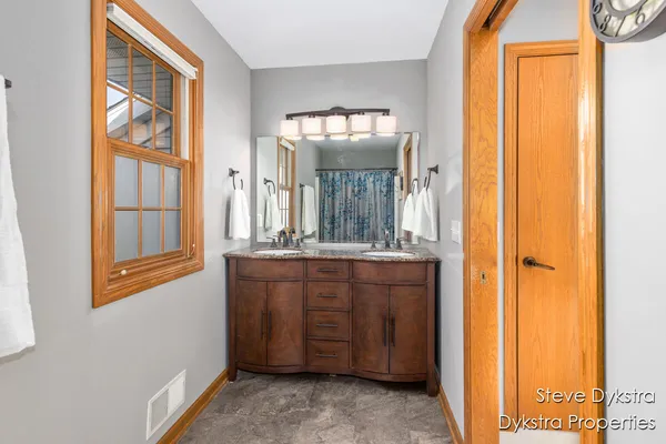 $615,000 | 2264 Grand Valley Drive Northeast, Ada, MI 49301