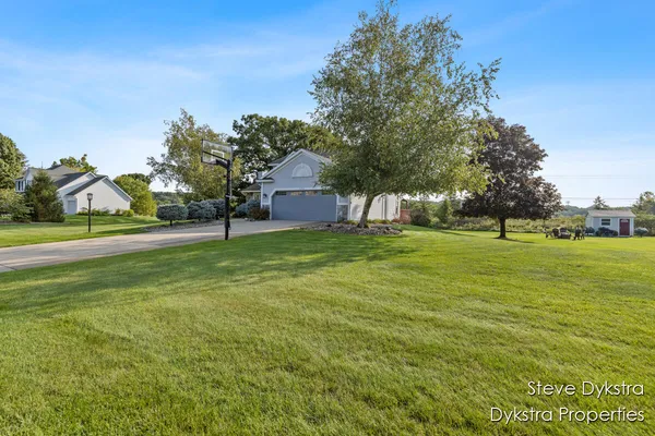 $615,000 | 2264 Grand Valley Drive Northeast, Ada, MI 49301