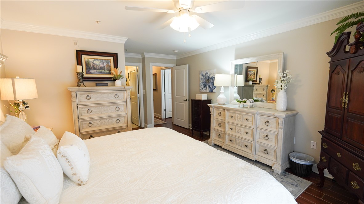 303 Lookover Drive Anderson, SC 29621 - Photo 31 of 46 This primary bedroom offers a spacious retreat with elegant crown molding and rich hardwood flooring.