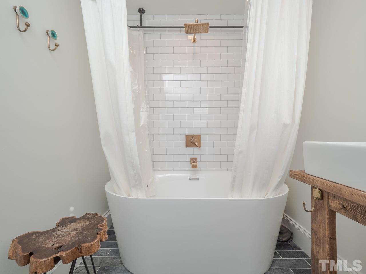 16 South Pettigrew Street Raleigh, NC 27610 - Photo 18 of 25 a view of a bathtub in a bathroom