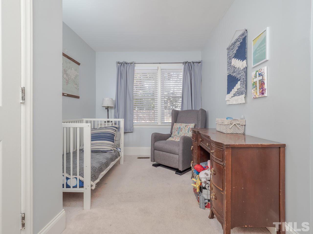 16 South Pettigrew Street Raleigh, NC 27610 - Photo 19 of 25 a living room with furniture and a window