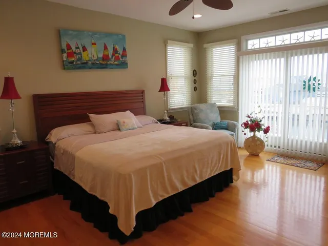 a bedroom with bed and window