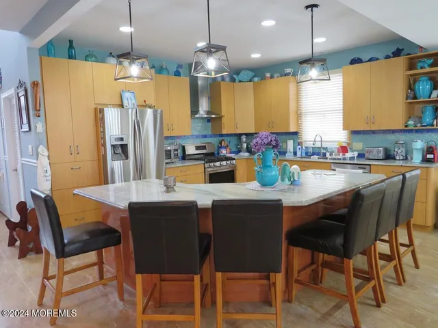 a dining table with chairs and window