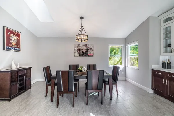 a view of a dining room with furniture window and wooden floor