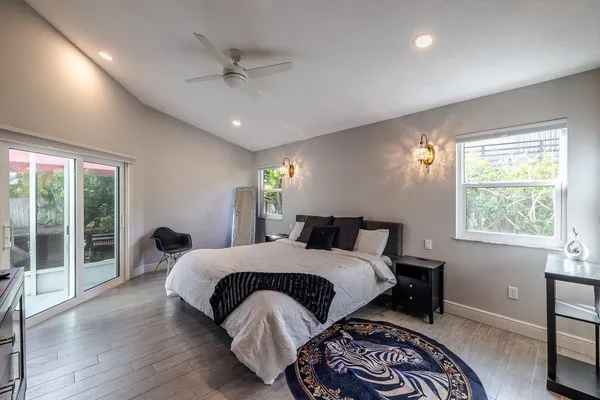 a bedroom with a bed and a table with chair