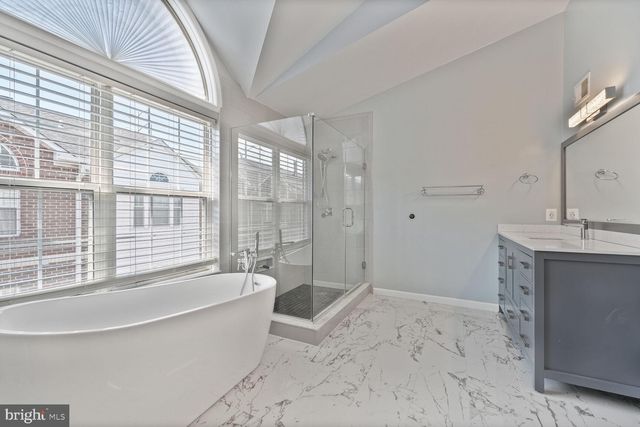 a bathroom with a bathtub and a sink
