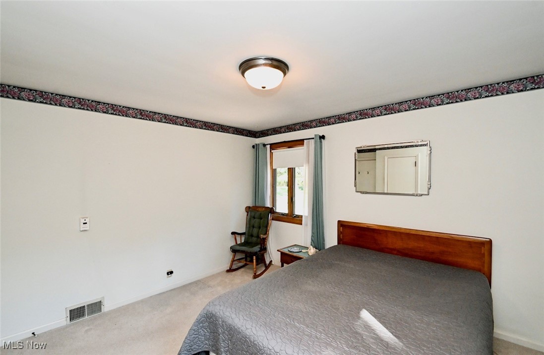 5653 Dailey Road New Franklin, OH 44319 - Photo 11 of 24 Bedroom with light carpet