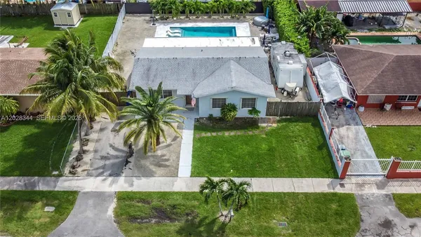 an aerial view of a house with a garden