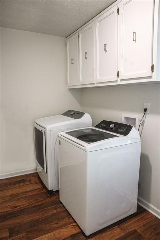 4970 Hull Road Southeast Conyers, GA 30094 - Photo 7 of 25 a utility room with wooden floor washer and dryer