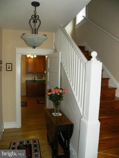 805 Russell Road Alexandria, VA 22301 - Photo 1 of 27 a view of a livingroom with furniture entryway wooden floor and a chandelier