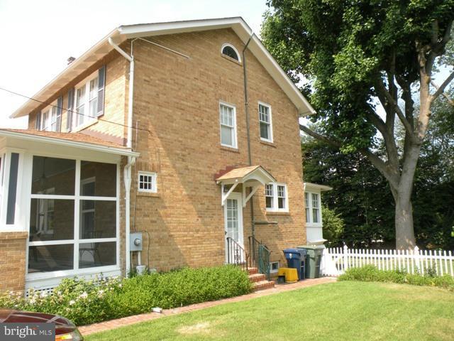 805 Russell Road Alexandria, VA 22301 - Photo 18 of 27 a front view of a house with a yard