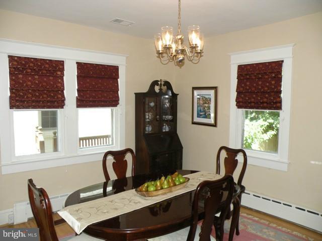 805 Russell Road Alexandria, VA 22301 - Photo 8 of 27 a view of a dining room with furniture window and wooden floor