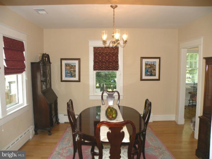 805 Russell Road Alexandria, VA 22301 - Photo 10 of 27 a view of a dining room with furniture window and wooden floor