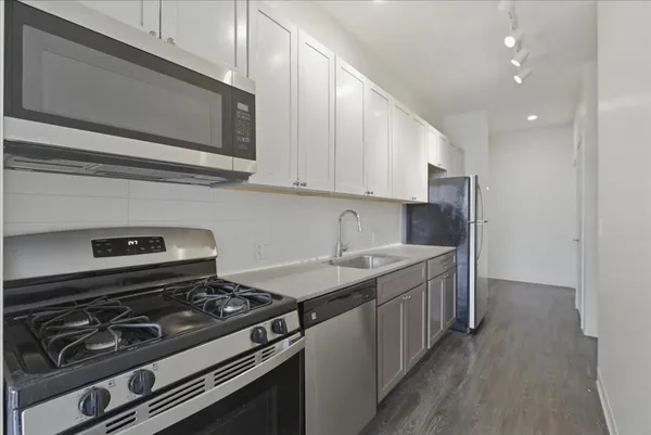 a kitchen with a stove and a microwave