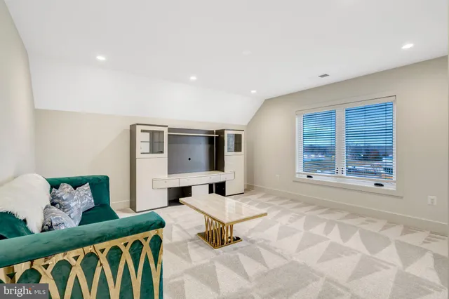 a bedroom with furniture and window