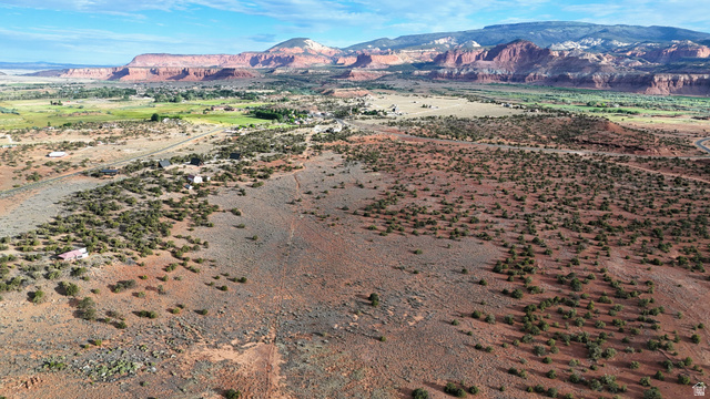 358 South Sky Drive Torrey, UT 84775 - Photo 64 of 82 Expansive desert landscape featuring natural brush, varied terrain, and distant red rock formations