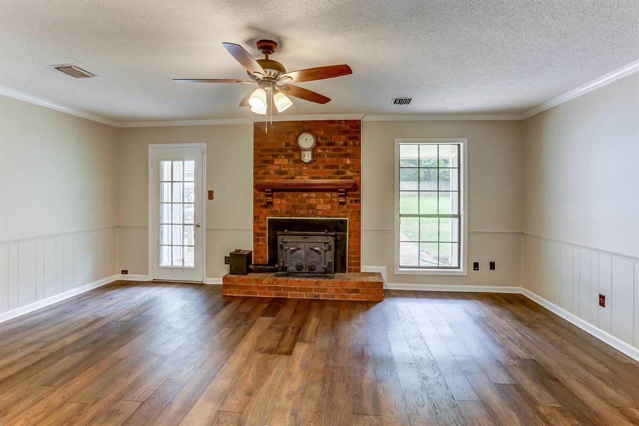 445 Dove Valley Road Collierville, TN 38017 - Photo 1 of 24 a living room with hardwood flooring and a fireplace