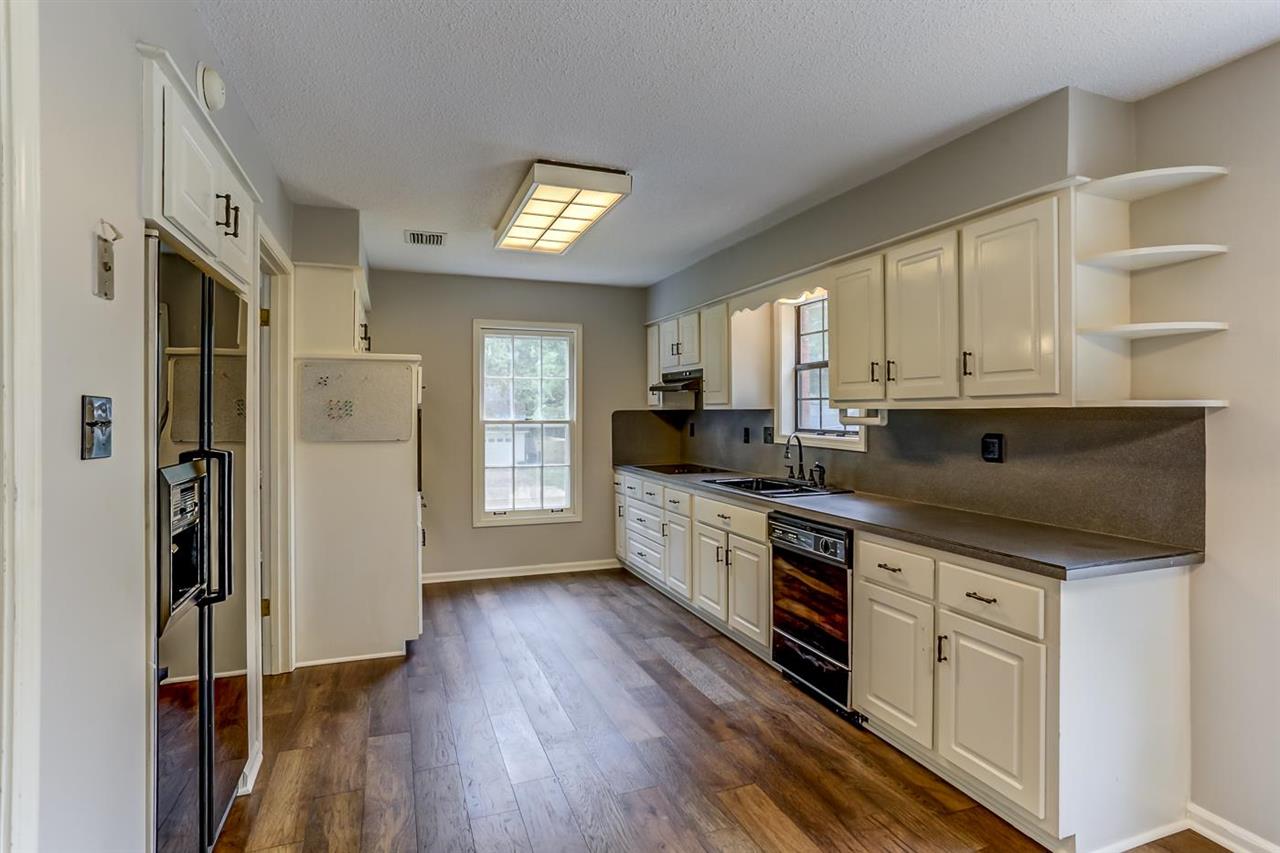 445 Dove Valley Road Collierville, TN 38017 - Photo 11 of 24 a kitchen with stainless steel appliances a refrigerator sink and cabinets