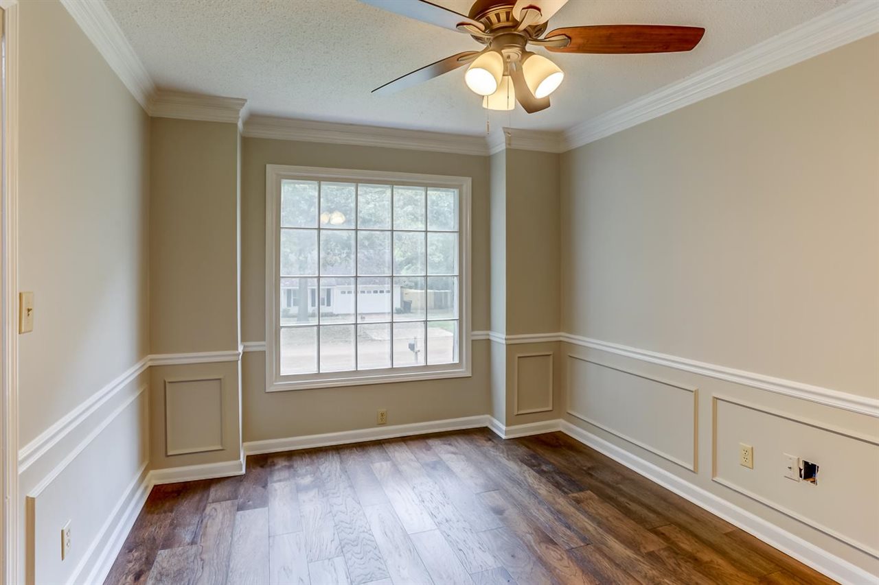 445 Dove Valley Road Collierville, TN 38017 - Photo 13 of 24 wooden floor in an empty room with a window