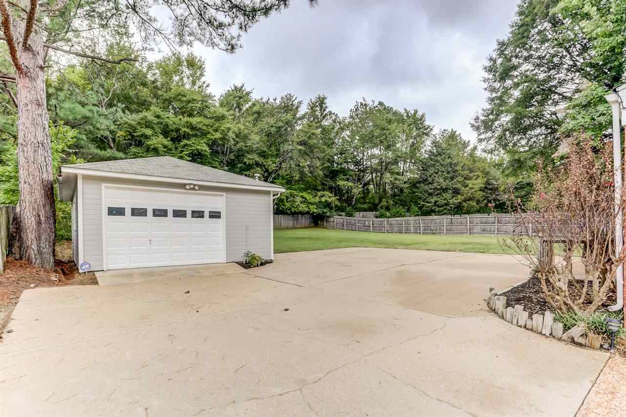 445 Dove Valley Road Collierville, TN 38017 - Photo 24 of 24 a view of a house with a yard and trees