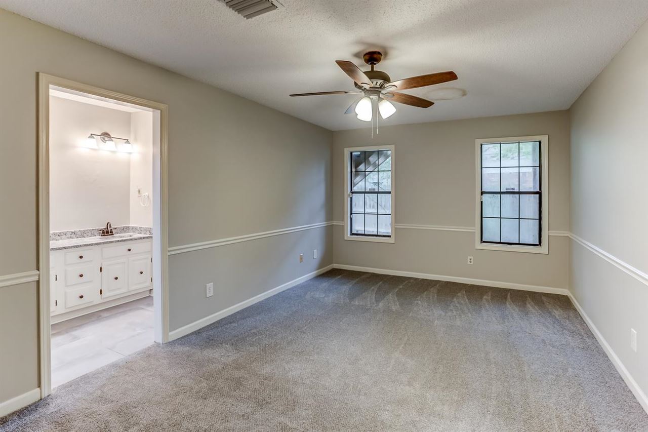 445 Dove Valley Road Collierville, TN 38017 - Photo 4 of 24 a view of an empty room with a window