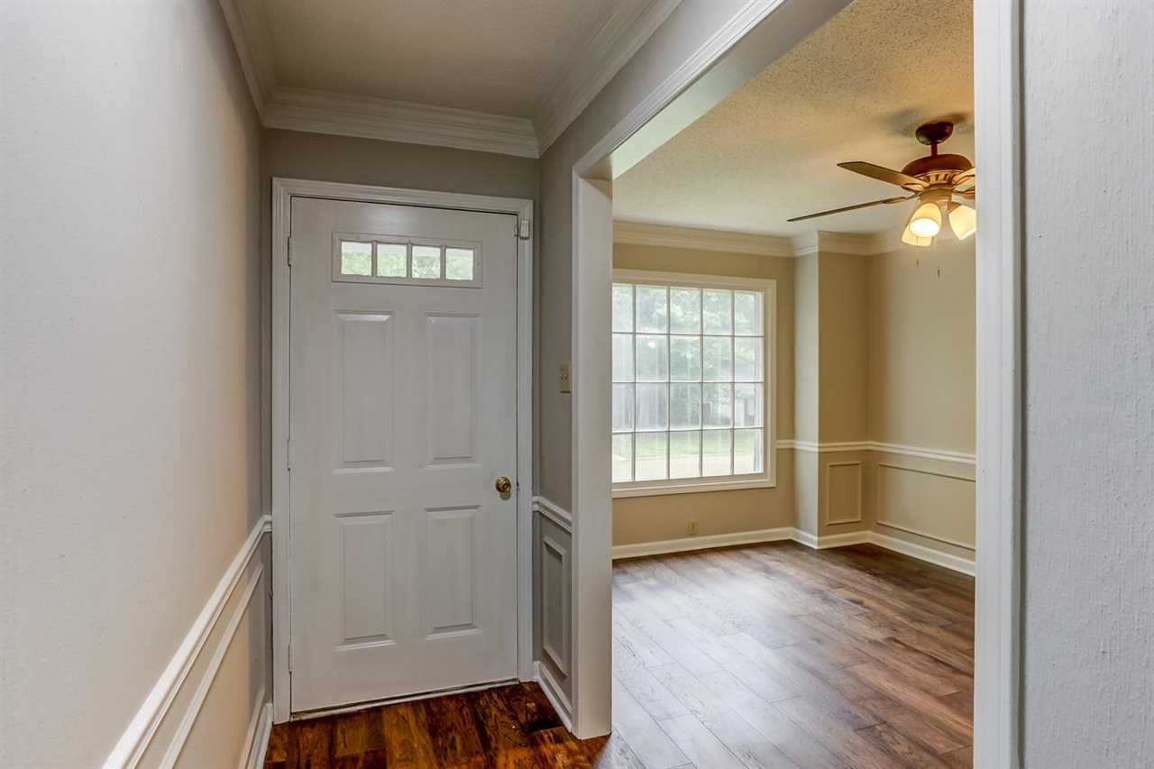 445 Dove Valley Road Collierville, TN 38017 - Photo 5 of 24 wooden floor in an empty room with a window