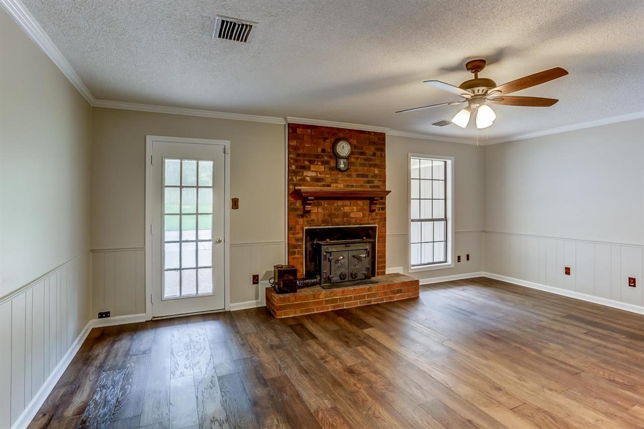 445 Dove Valley Road Collierville, TN 38017 - Photo 8 of 24 wooden floor in an empty room with a window