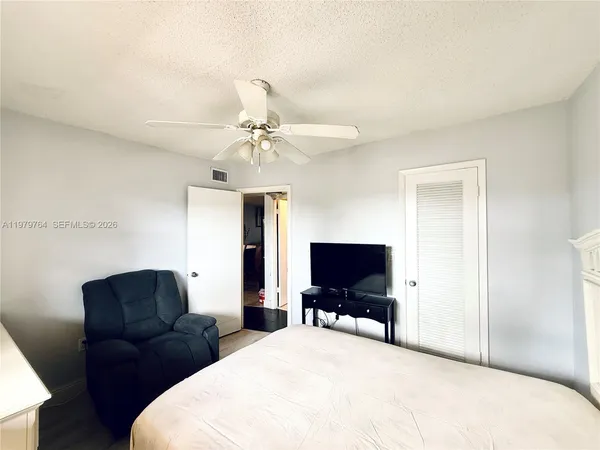 a spacious bathroom with a sink a toilet and shower
