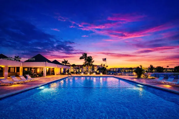 a view of an swimming pool with an outdoor seating
