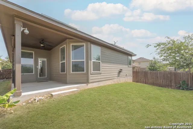 a view of a backyard of the house