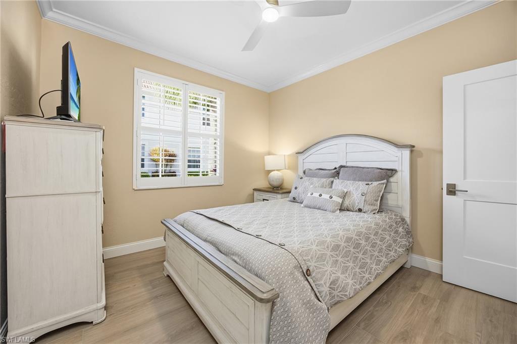 23151 Rosedale Drive, Unit 101 Estero, FL 34135 - Photo 12 of 20 Bedroom with new crown, floor and window molding. New floor. New queen bed & frame, dresser, nightstand and lamp can be included.