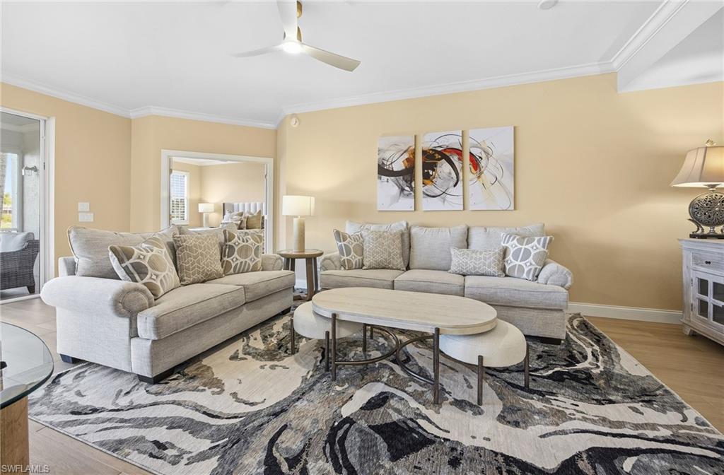 23151 Rosedale Drive, Unit 101 Estero, FL 34135 - Photo 5 of 20 Living room with new crown, door and floor molding. Furnishings are new and can be included.